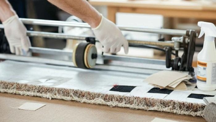 Homeowner using preventive measures to protect carpet and avoid future damage